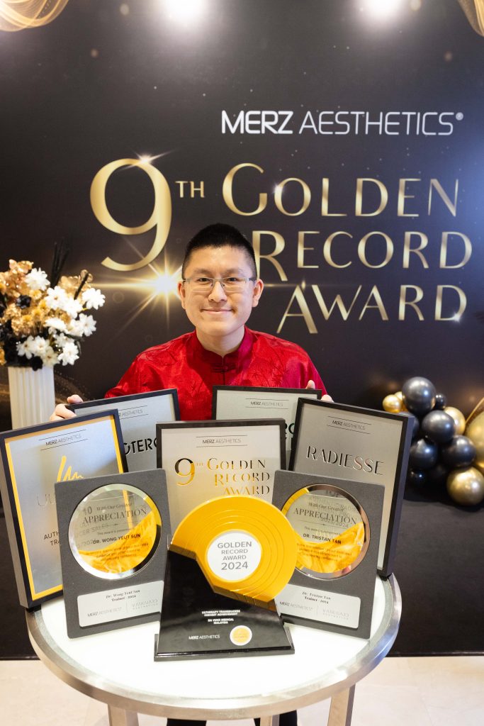 Dr. Kenneth from Da Vinci Clinic receiving awards for aesthetic excellence at Merz Aesthetics 9th Golden Record Awards.