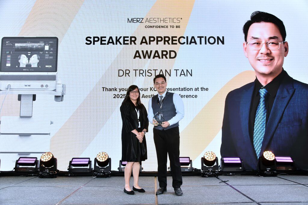 Dr. Tristan receiving the Speaker Appreciation Award for his expertise in Ultherapy Prime and non-surgical facelifts.