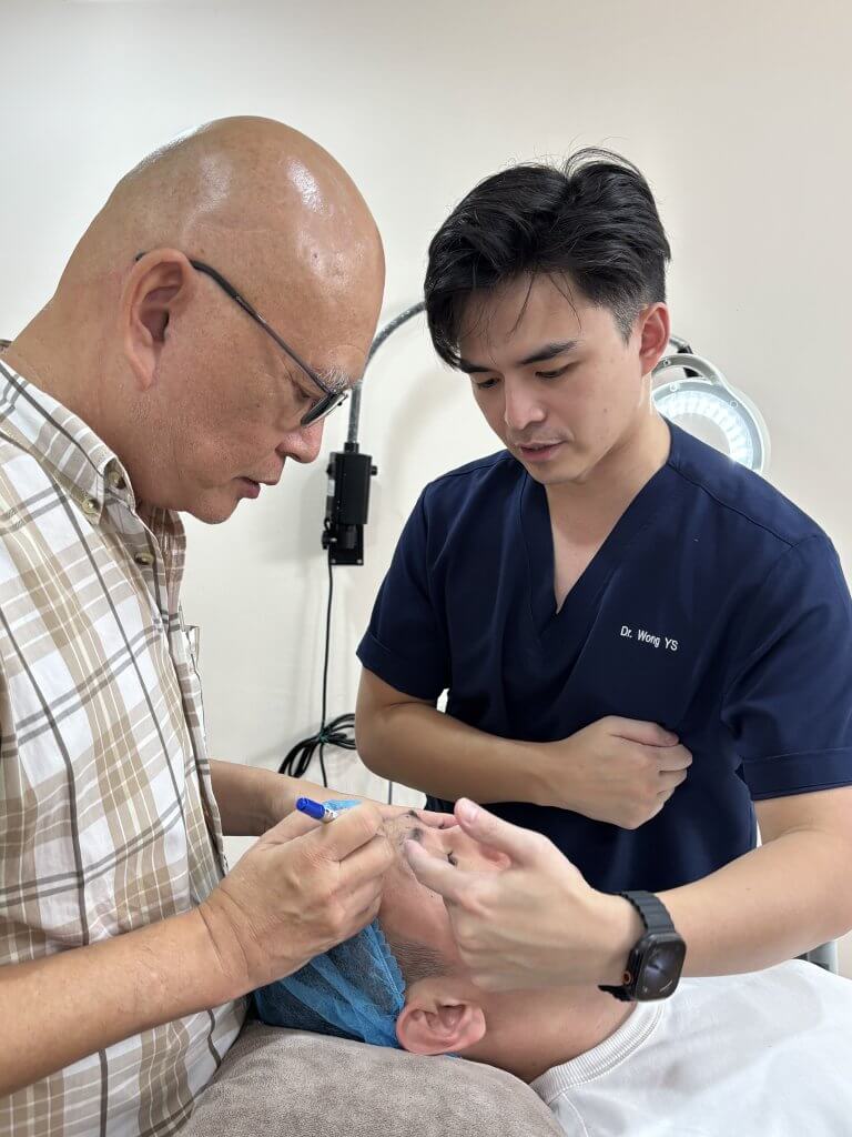 Dr. Tristan and Dr. Wong leading a Botox training session for aesthetic doctors, demonstrating advanced wrinkle relaxation and anti-aging techniques.