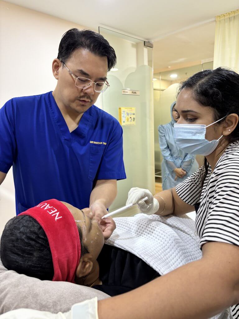 Dr. Tristan demonstrating Neauvia injection techniques to junior doctors during an in-house training session at Da Vinci Clinic.