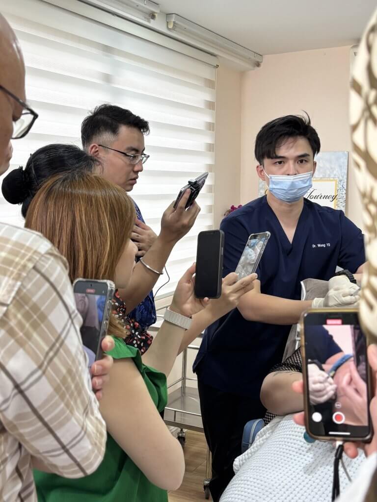 Dr. Wong and Dr. Tristan leading a professional session on wrinkle relaxers and Botox for local aesthetic doctors.