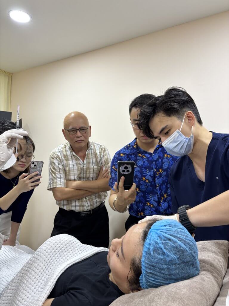 Dr. Wong and Dr. Tristan leading a professional session on wrinkle relaxers and Botox for local aesthetic doctors.
