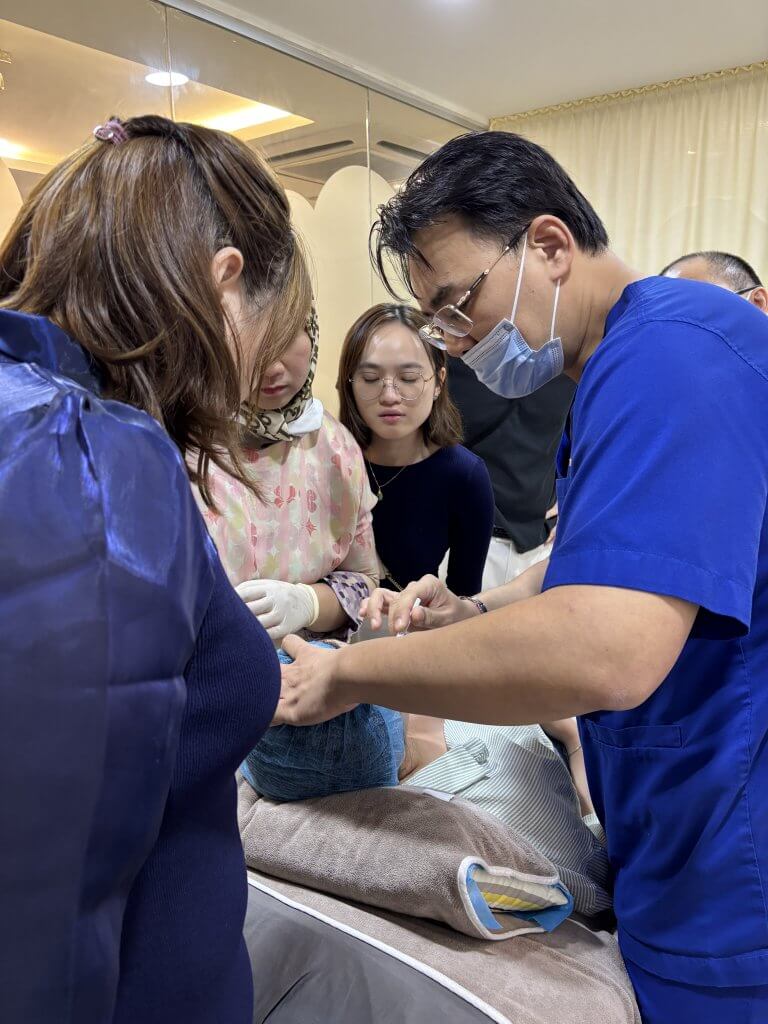 Dr. Wong and Dr. Tristan leading a professional session on wrinkle relaxers and Botox for local aesthetic doctors.