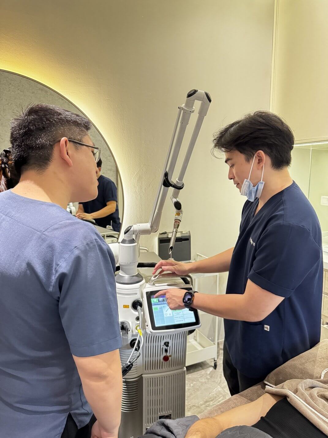 Dr. Wong demonstrating the Fotona NX Line machine